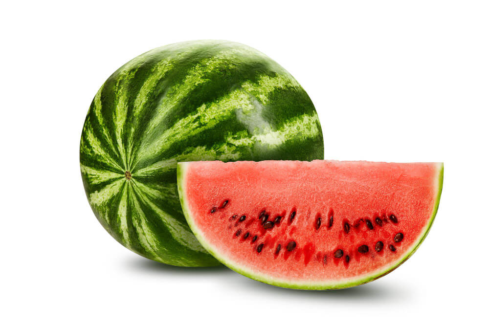 Whole watermelon with a juicy red slice, rich in water and antioxidants, listed among skin whitening foods for natural glow.